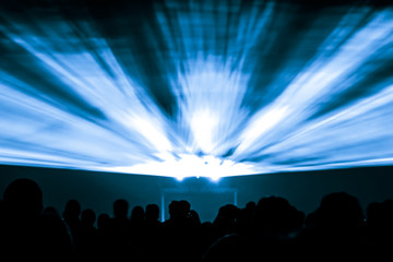 Laser show rays in blue colors. Best visual show with a crowd silhouette and great laser rays for e.g. an illustration background of an invitation flyer