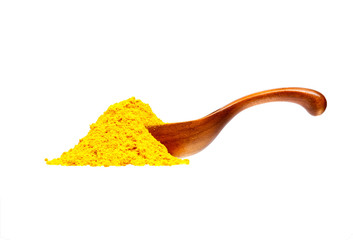 Naklejka premium Yellow curry powder in the wooden spoon, isolated on white backg