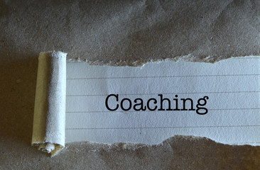 Torn Paper With Word Coaching
