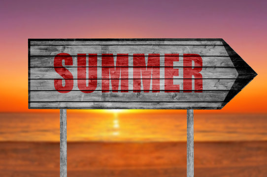 Red Summer wooden sign with on a beach background