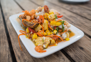 papaya salad with seafood and corn selective focus