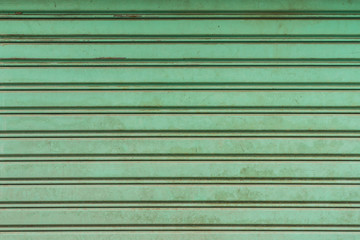 dirty shutters over a shop doors