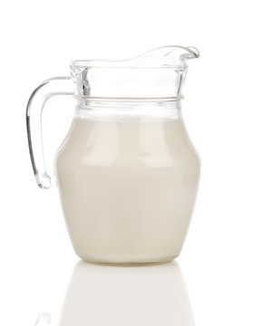Pitcher of milk on a white background