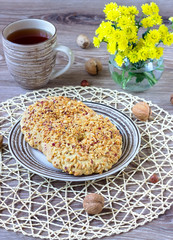 nut cookies on a striped plate on a wattled napkin