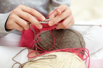 Little child learns to knit. Lifestyle - childhood
