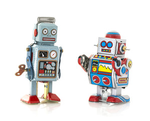 Two Retro Tin Robot on a White Background - obrazy, fototapety, plakaty