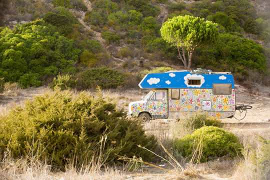 old retro hippie camper at Zavial beach in Portugal