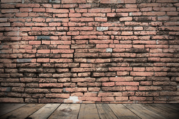 old brick wall on brown wooden floor for background design