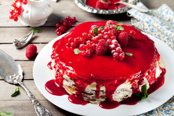 Traditional crepe cake with custard and berry