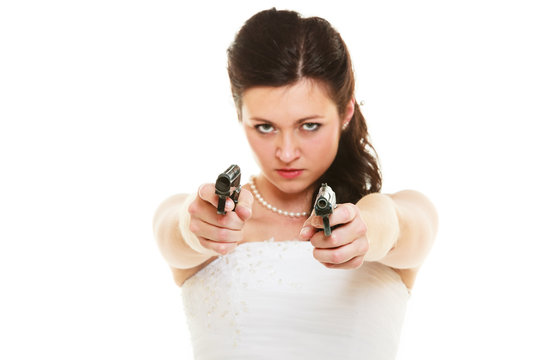 Angry bride with gun isolated on white.