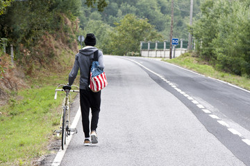 young boy with bike outdoors