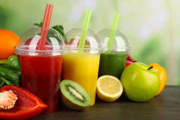 Fresh juice mix fruit, healthy drinks on wooden table, on bright background