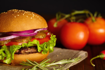 Fresh burger on a wooden board.