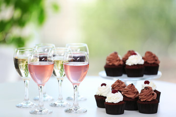 Tasting of wine and chocolate cupcakes, close up