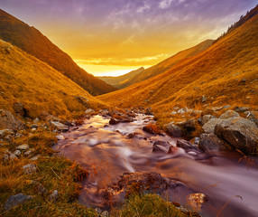 Autumn Landscape -- River Sunset in Fagaras Mountains, Romania.