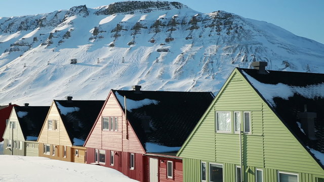 A small town in the far north of Europe among the snow-capped mountains. Longyearbyen, Svalbard.