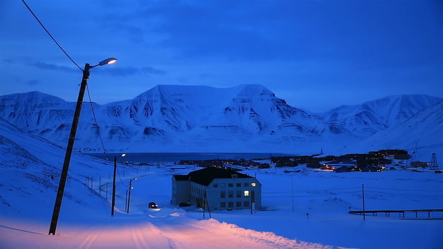 A small town in the far north of Europe among the snow-capped mountains at night. Longyearbyen, Svalbard.