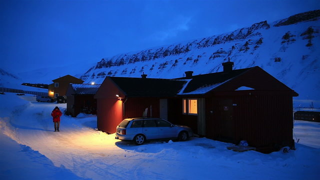 A small town in the far north of Europe among the snow-capped mountains at night. Longyearbyen, Svalbard.
