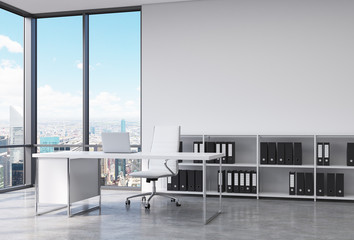 A CEO workplace in a modern corner panoramic office in New York city. A white desk with a laptop, white leather chair and a bookshelf with black document folders. 3D rendering.