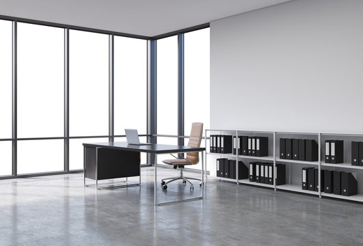 A workplace in a modern corner panoramic office with copy space in the windows. A black desk with a laptop, brown leather chair and a bookshelf with black document folders. 3D rendering.