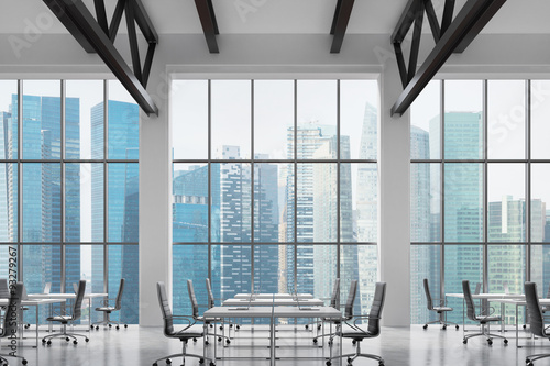Modern workplaces in a modern bright clean interior of a loft style office huge windows Modern workplaces in a modern bright clean interior of a loft style office huge windows