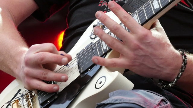 Guitarist playing  guitar at rock festival