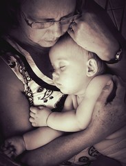 Grandmother relaxing with her granddaughter on sepia - obrazy, fototapety, plakaty