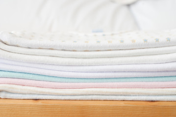 stack of baby clothes - studio shot