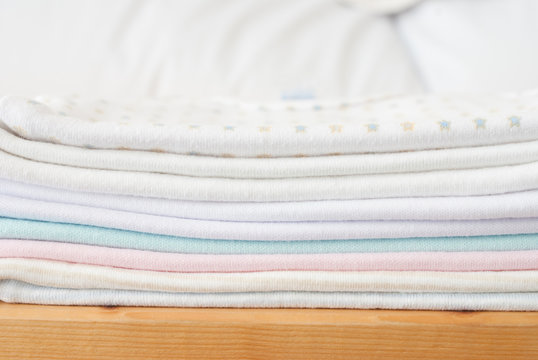 Stack Of Baby Clothes - Studio Shot