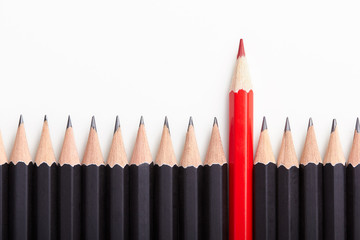 Red pencil standing out from crowd