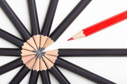 Red Pencil Standing Out From Crowd