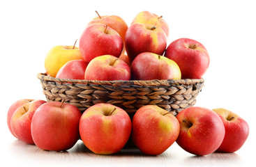 Naklejka na ściany i meble Apples in wicker basket isolated on white