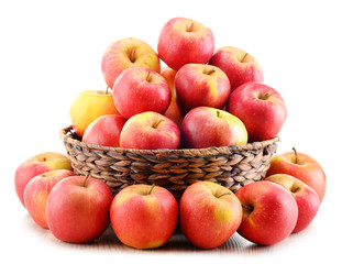 Fototapeta na wymiar Apples in wicker basket isolated on white