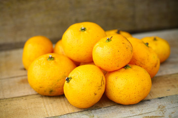 Fresh orange on wooden table in dining room. Healthy fruit for lose weight ,Fresh oranges on wooden background.