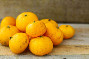 Fresh orange on wooden table in dining room. Healthy fruit for lose weight ,Fresh oranges on wooden background.