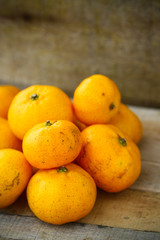 Fresh orange on wooden table in dining room. Healthy fruit for lose weight ,Fresh oranges on wooden background.