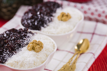 Rice Pudding and Strawberry Jam with Nuts, New Year Decoration in Red Color