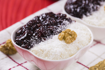 Rice Pudding and Strawberry Jam with Nuts, New Year Decoration in Red Color
