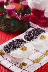 Rice Pudding and Strawberry Jam with Nuts, New Year Decoration in Red Color