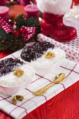 Rice Pudding and Strawberry Jam with Nuts, New Year Decoration in Red Color