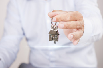 Hand with a house key