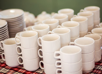 Lot of tea cups stacked one on one, catering on a banquet.