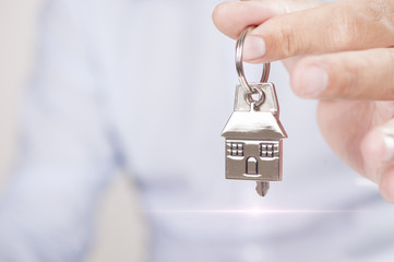 Hand with a house key