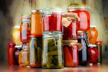 Jars with pickled vegetables and fruity compotes