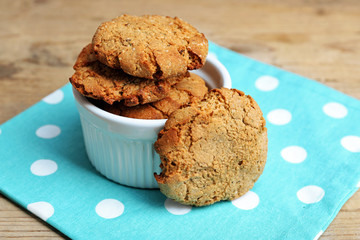 Homemade cookies in small bowl on table close up