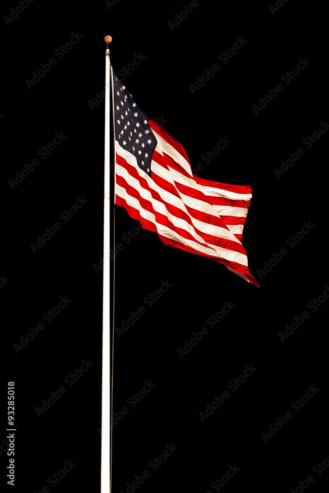 Wall mural american flag on a pole flying against a black background. copy space