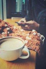 Woman drink coffee with smartphone and scart