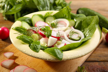 Fresh vegetable salad on table close up