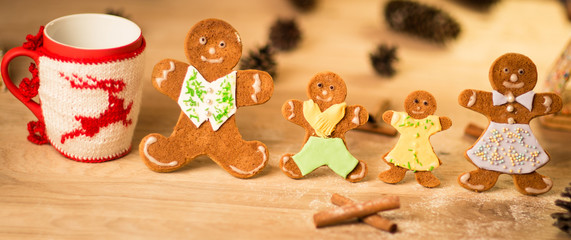 gingerbread men on the wooden floor with Christmas decorations