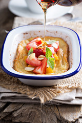 Baked pancake with oranges and strawberries